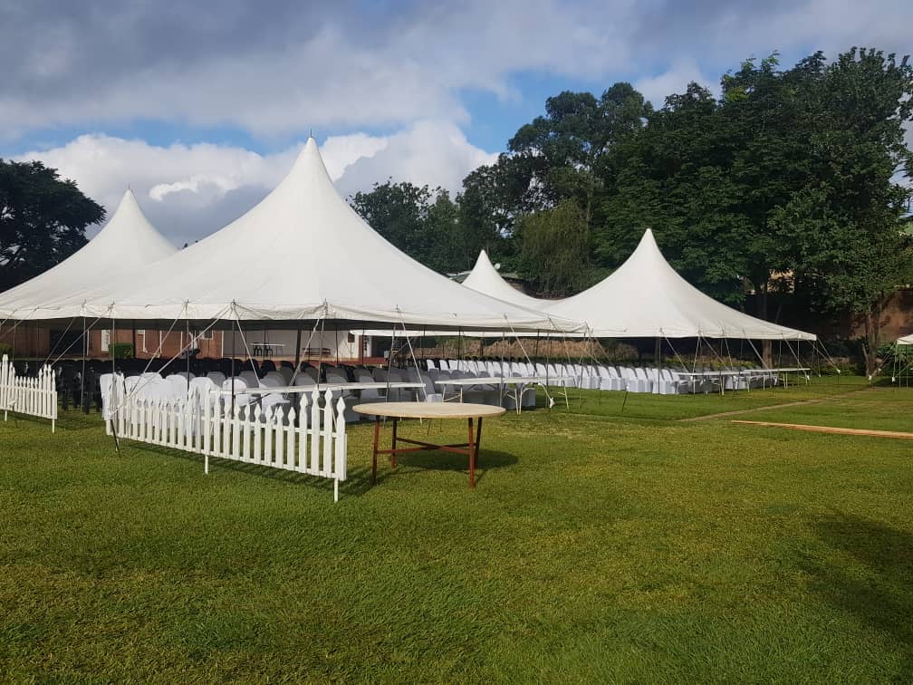 Large white cabana tents set up with chairs at Ma Nkosi Events Centre